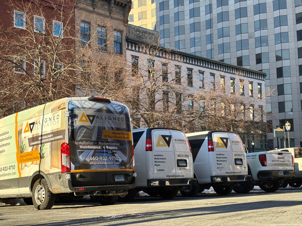 Aligned Elevator service trucks in Connecticut